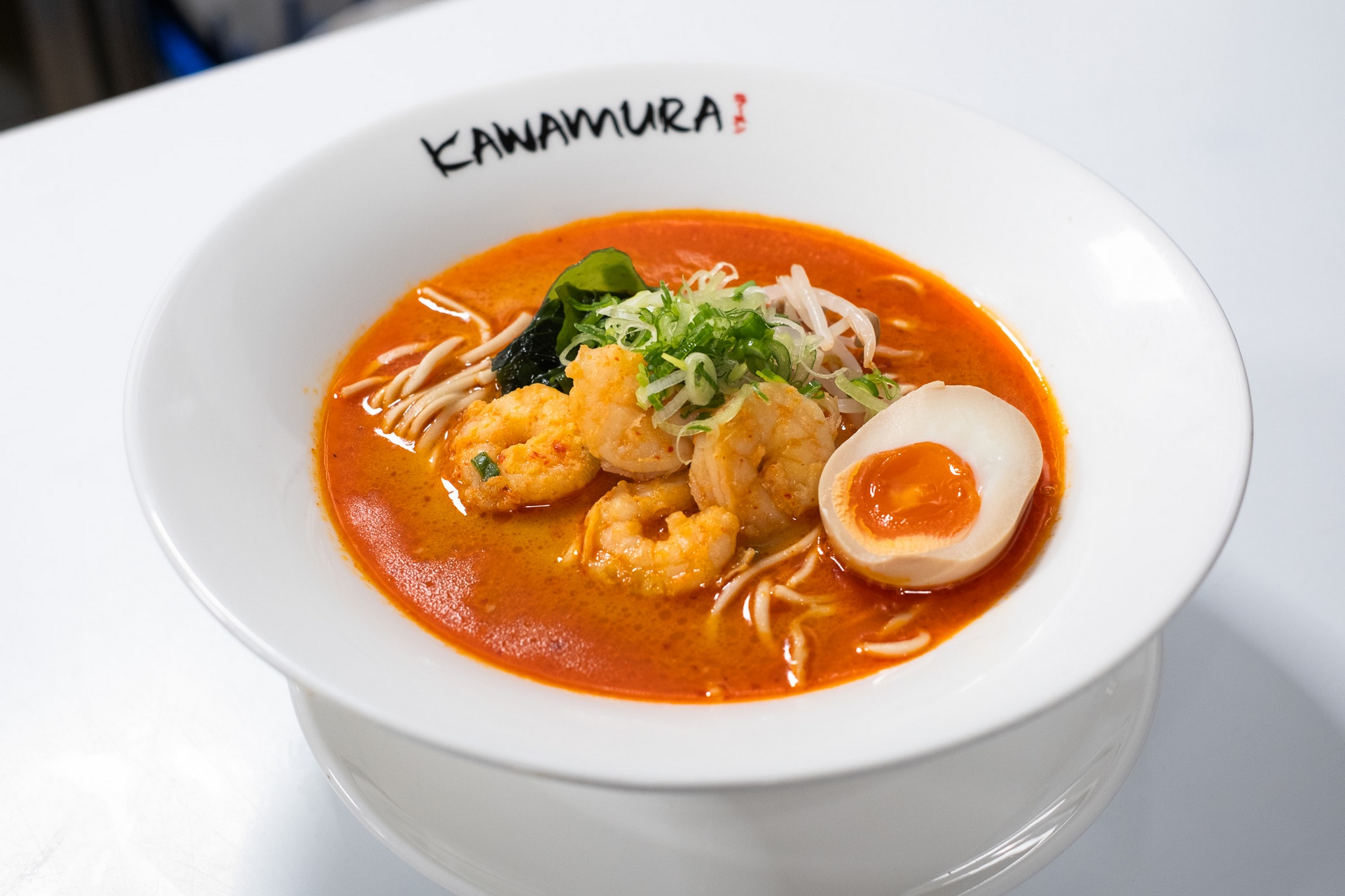 Spicy shrimp ramen with prawns, soft-boiled egg, and scallions in chili broth at Kawamura Ramen Budapest