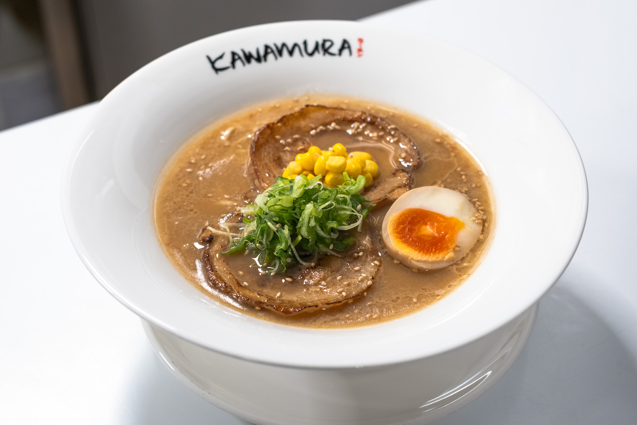 Shoyu chashumen ramen with sliced pork chashu, soft-boiled egg, and corn at Kawamura Ramen Budapest