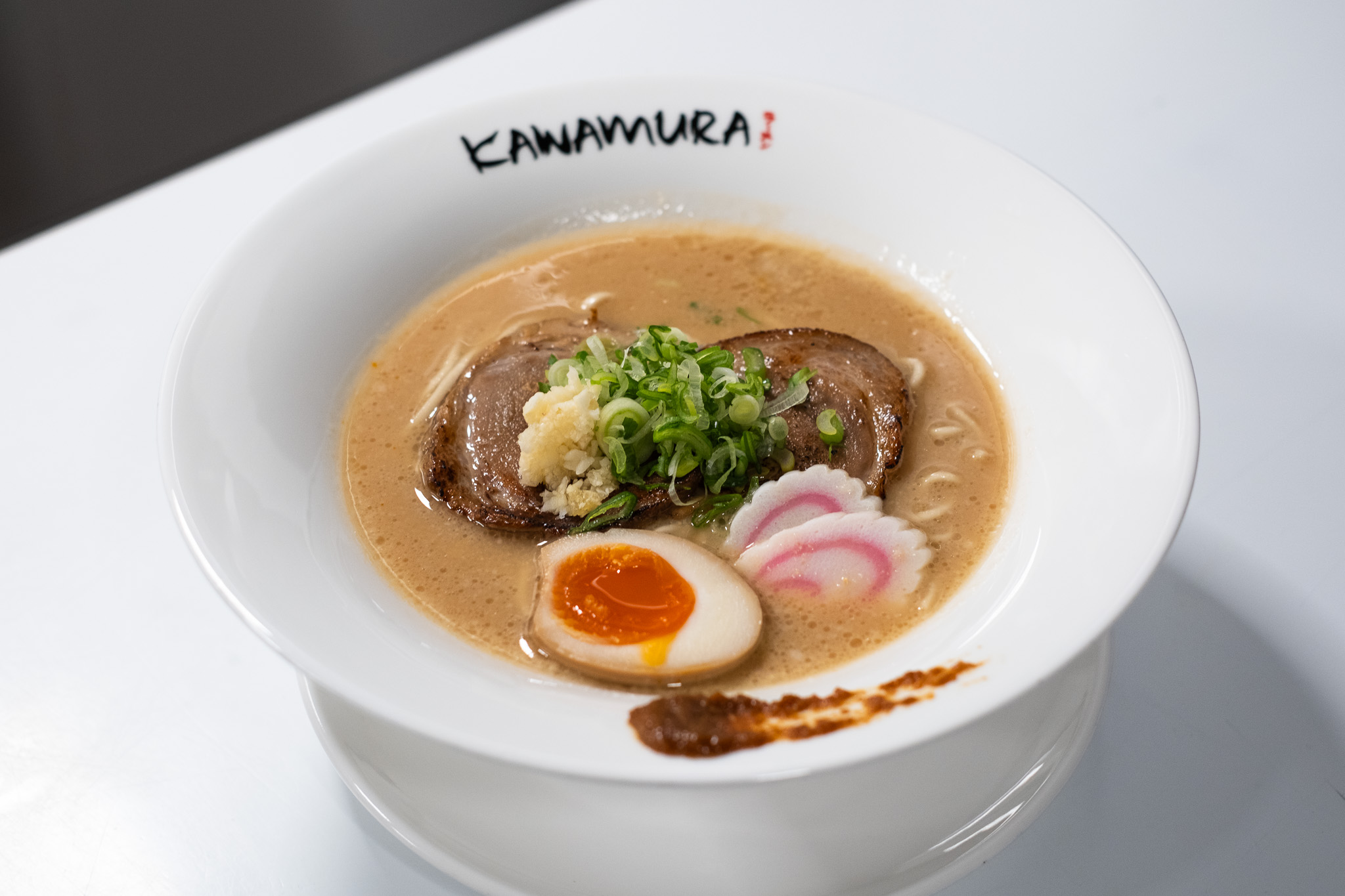 Naruto ramen with chashu pork, soft-boiled egg, narutomaki, and scallions at Kawamura Ramen Budapest