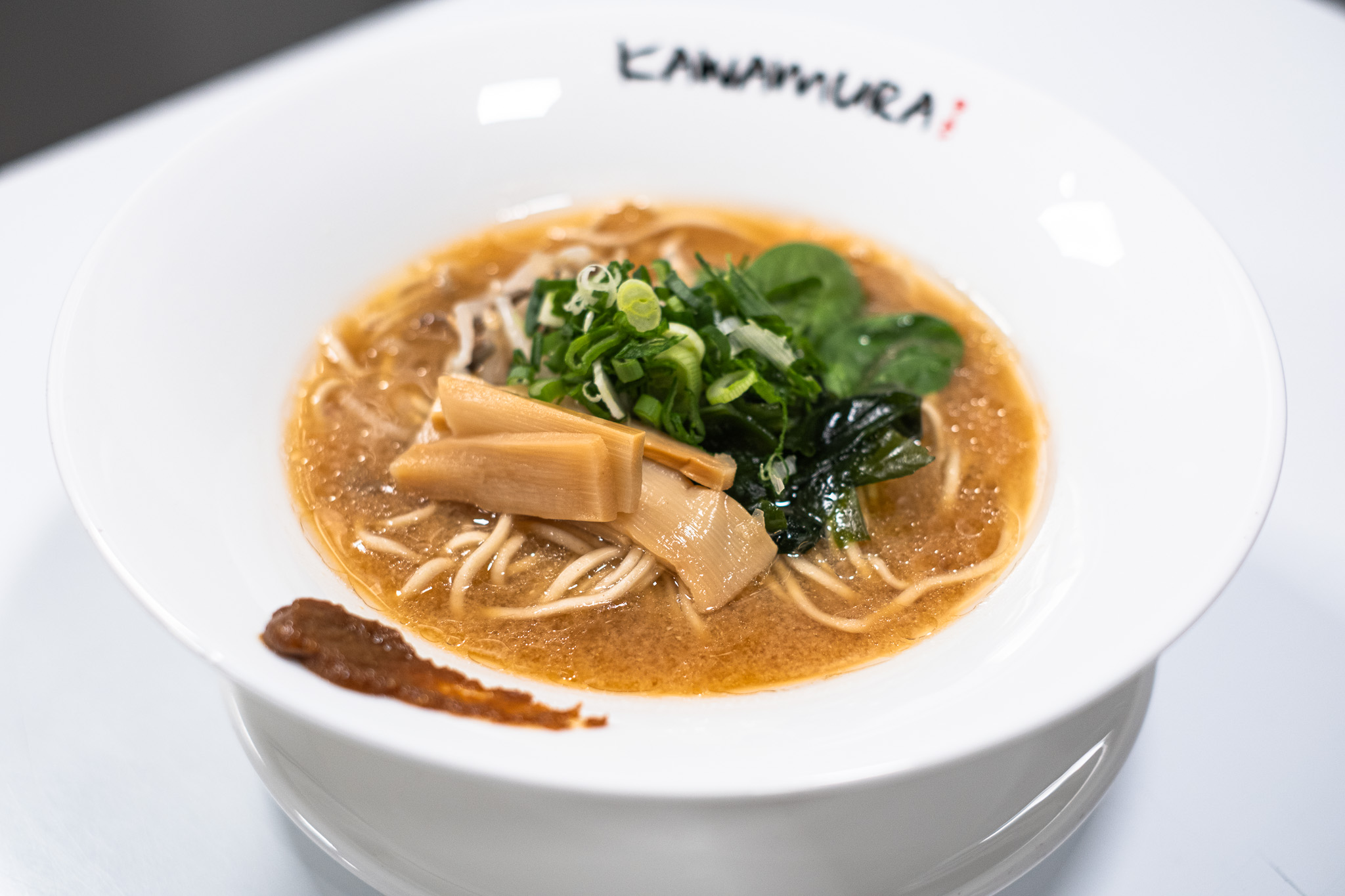 Vegan miso ramen with bamboo shoots, greens, and scallions at Kawamura Ramen Budapest